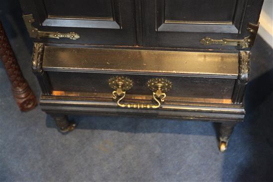 An Aesthetic movement ebonised music cabinet, in the manner of Morris & Co., W.30in.